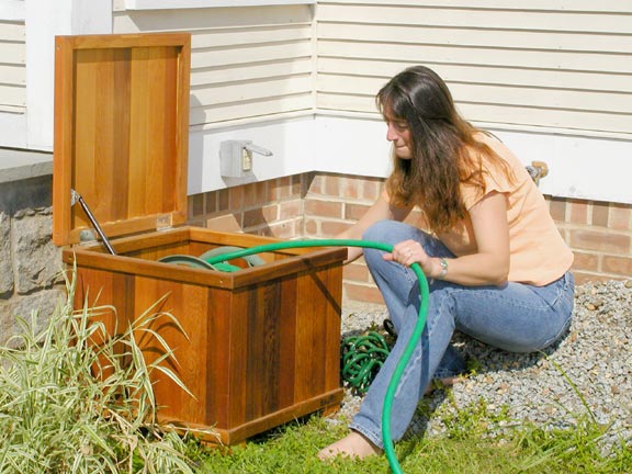 Cedar hose reel box - For storing the unsightly garden hose and reel.